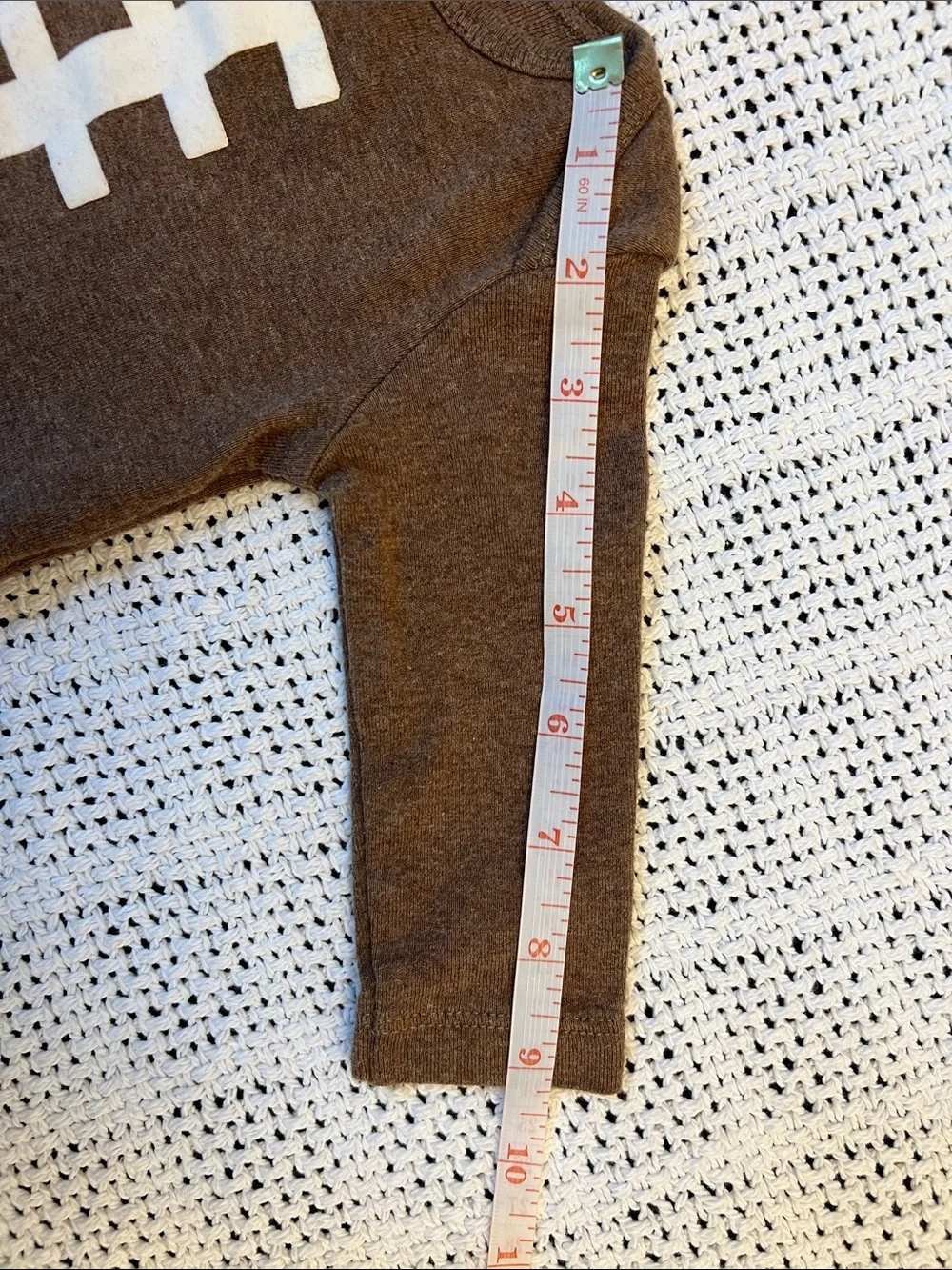 Carter’s | Brown Football-Stitch Long-Sleeve Baby One-Piece Size 3 Months